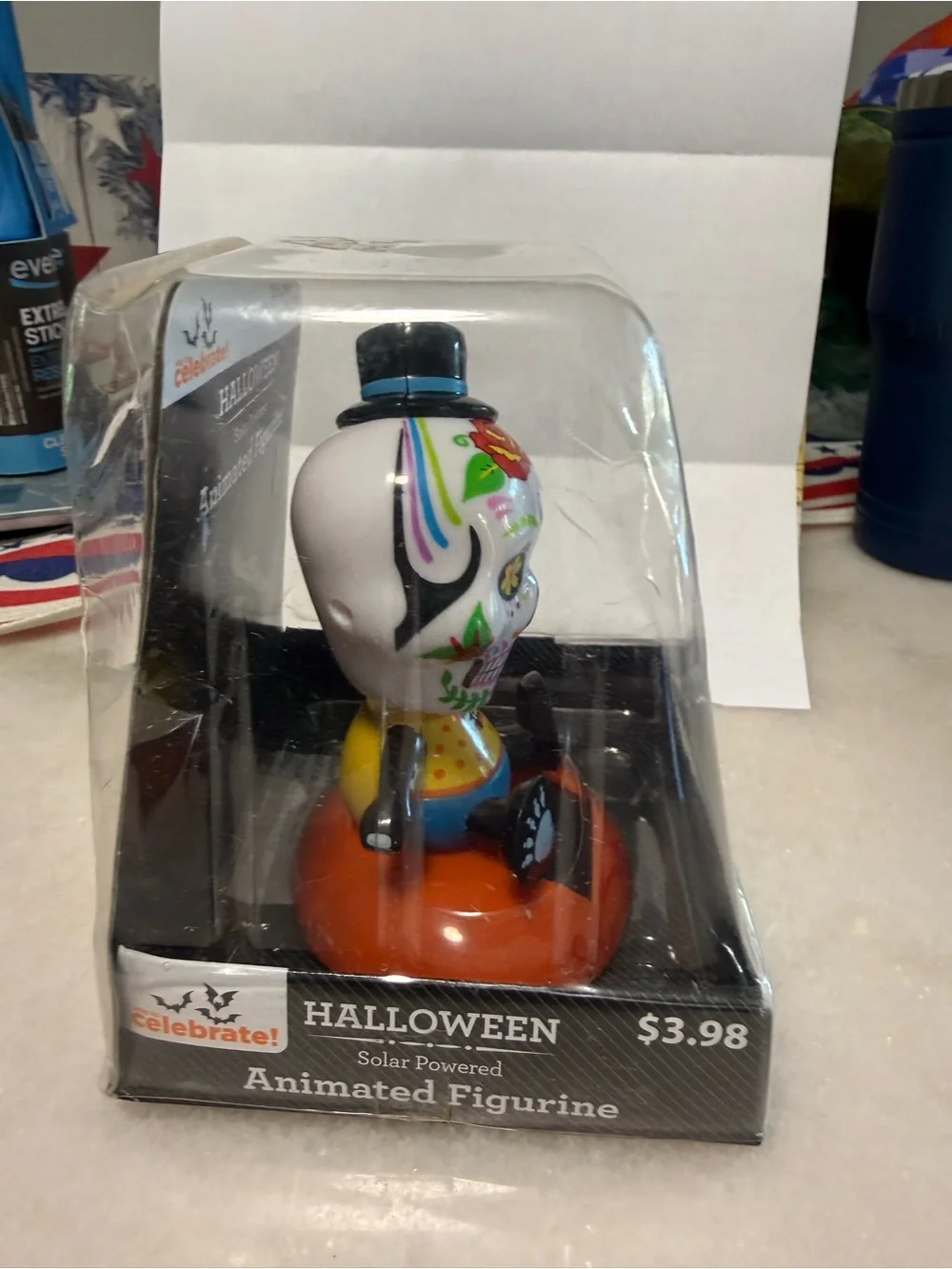 Day of the Dead Skull Solar-Powered Animated Figurine - White & Orange